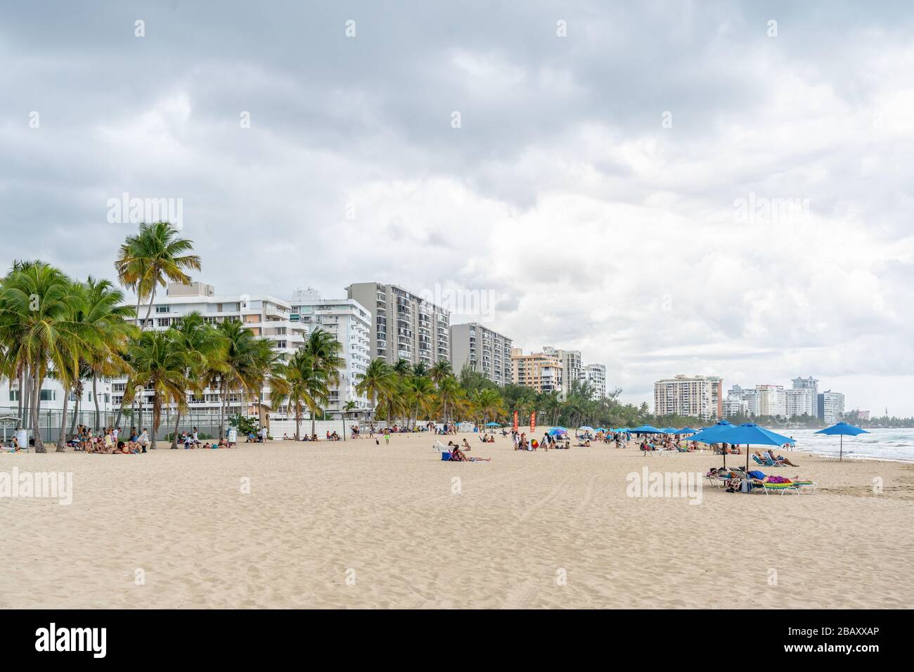 Isla Verde, Puerto Rico - March 29, 2019: Beach-goers Enjoying the Beautiful Beaches of Isla Verde, Puerto Rico. Stock Photo