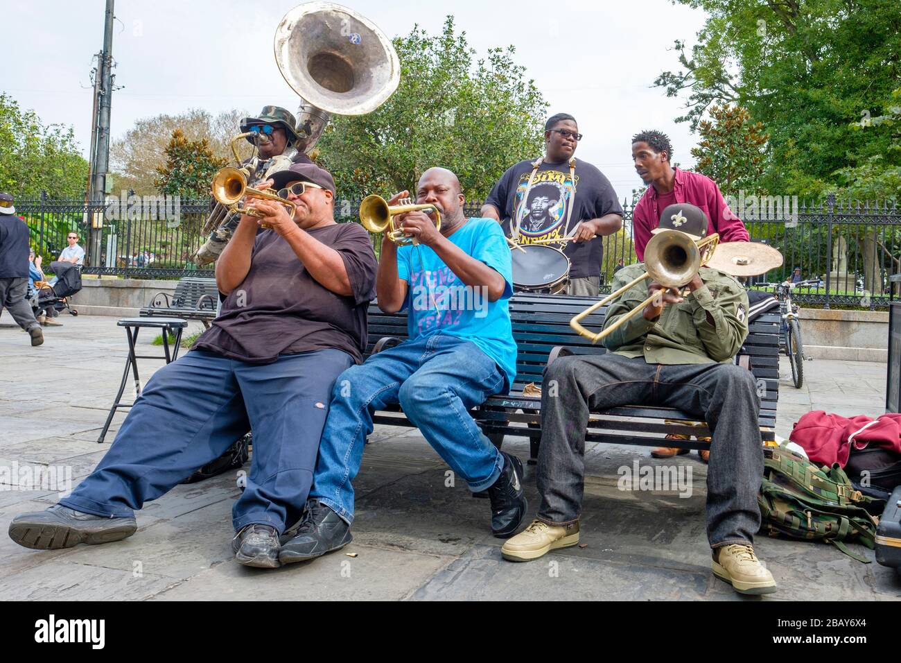 Street brass band singing, musicians playing jazz music on Jackson Square, New Orleans French Quarter New Orleans, Louisiana, USA. Stock Photo