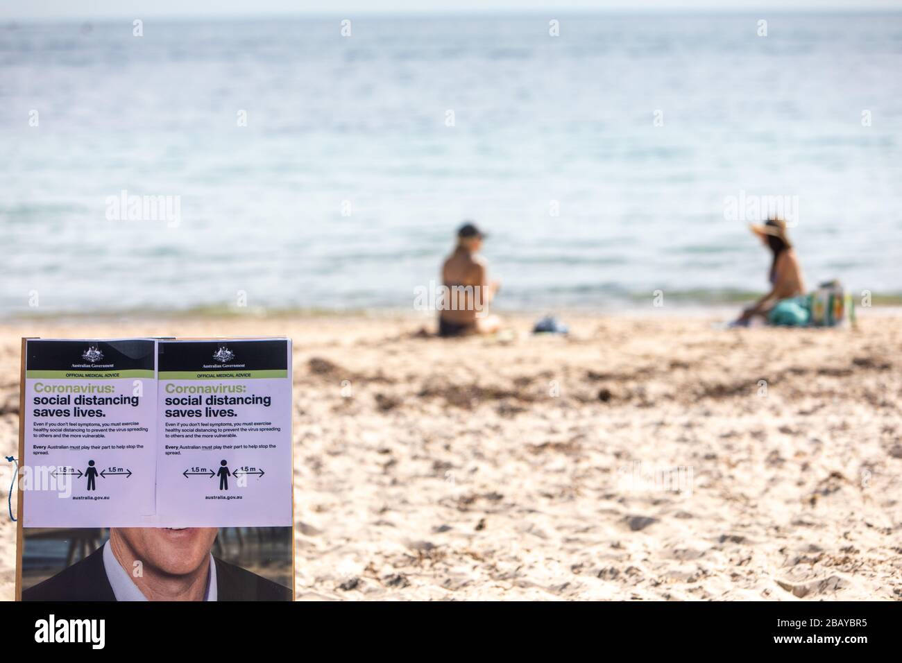 Surf life savers make a public announcement regarding social distancing of 1.5m on Somerton Beach during the Corona Virus Pandemic in Australia. Stock Photo