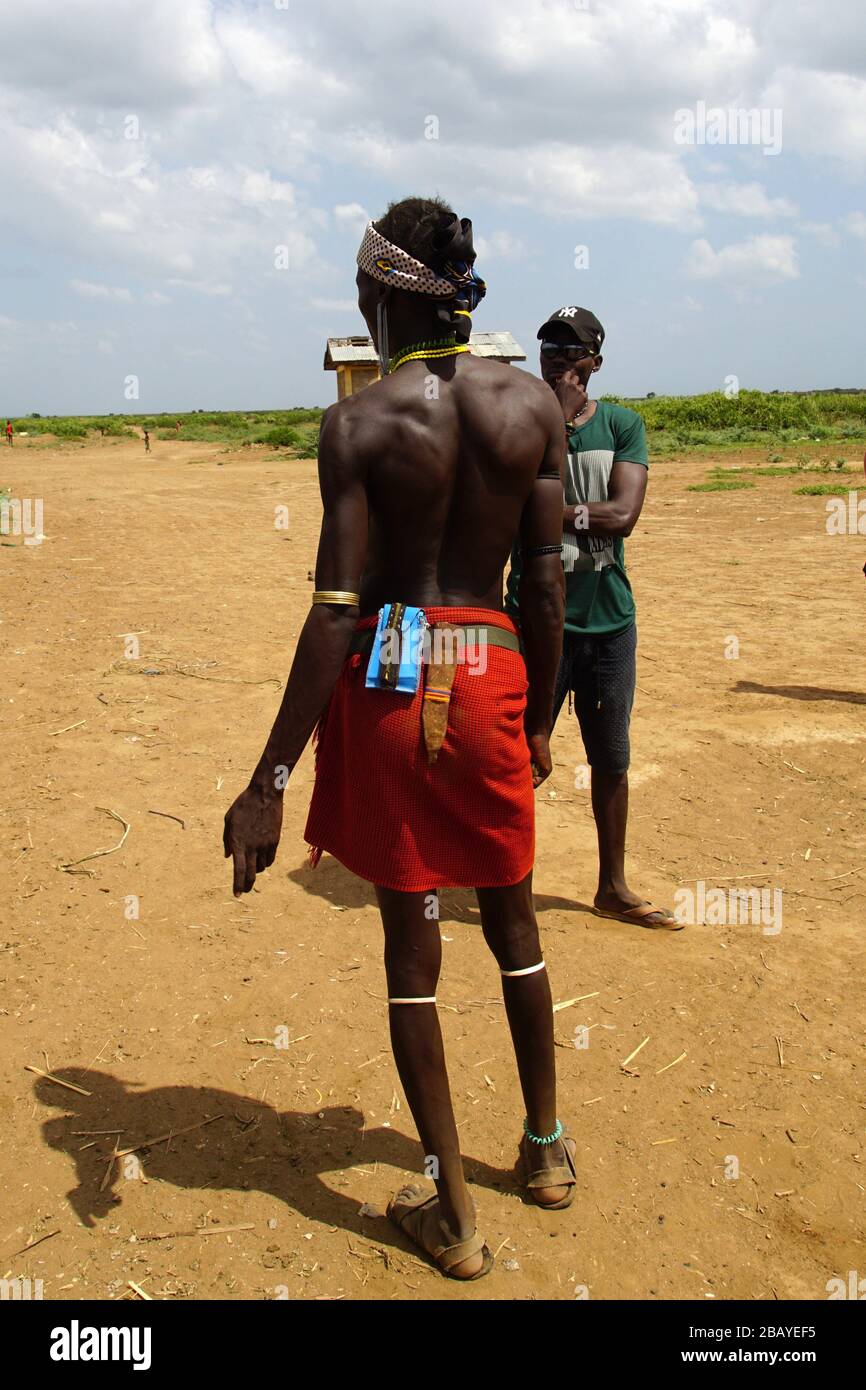 Back View of a young Dassanech Man in a fancy short Skirt Stock Photo