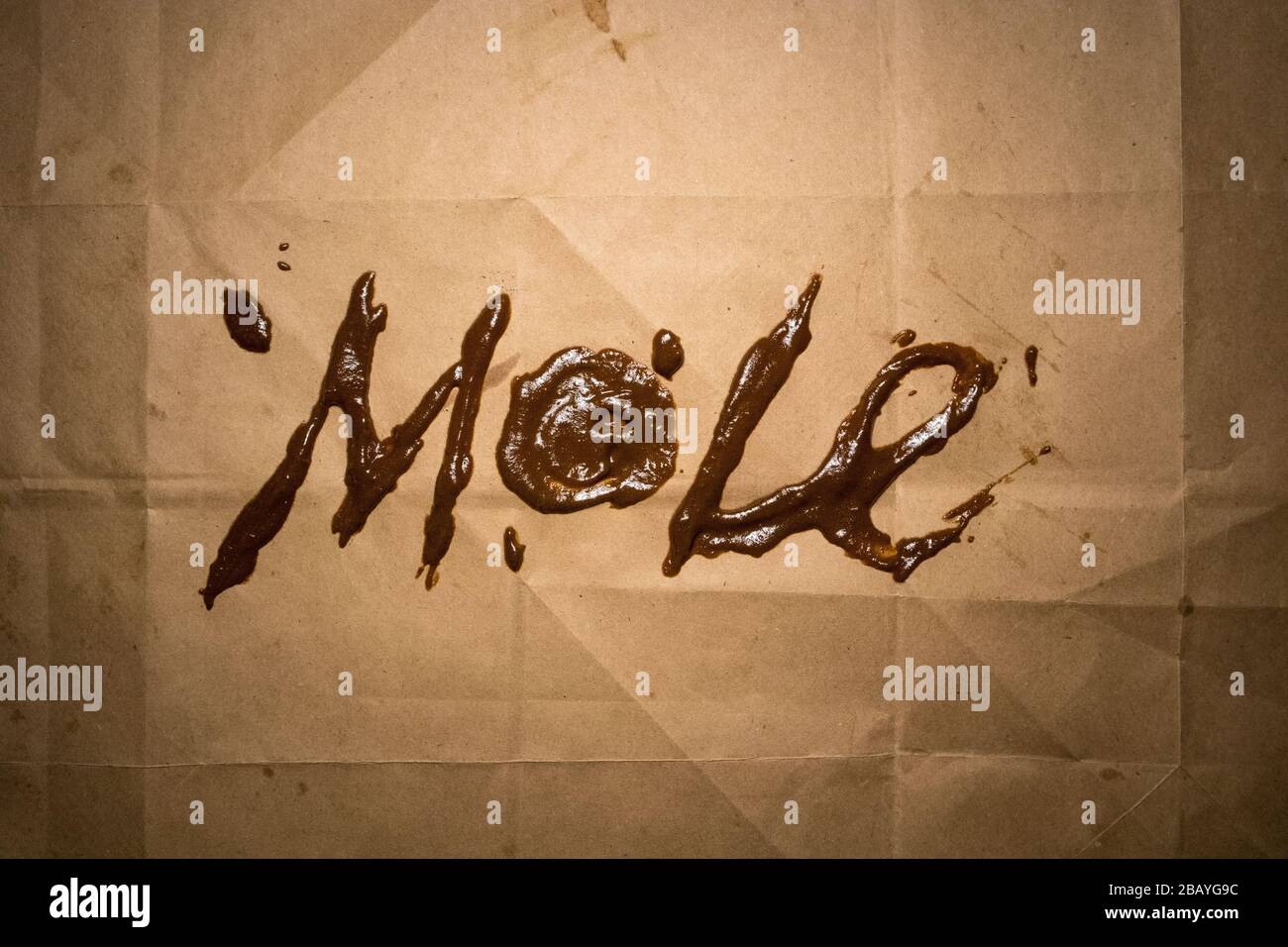The word "mole" written in mole sauce Stock Photo - Alamy