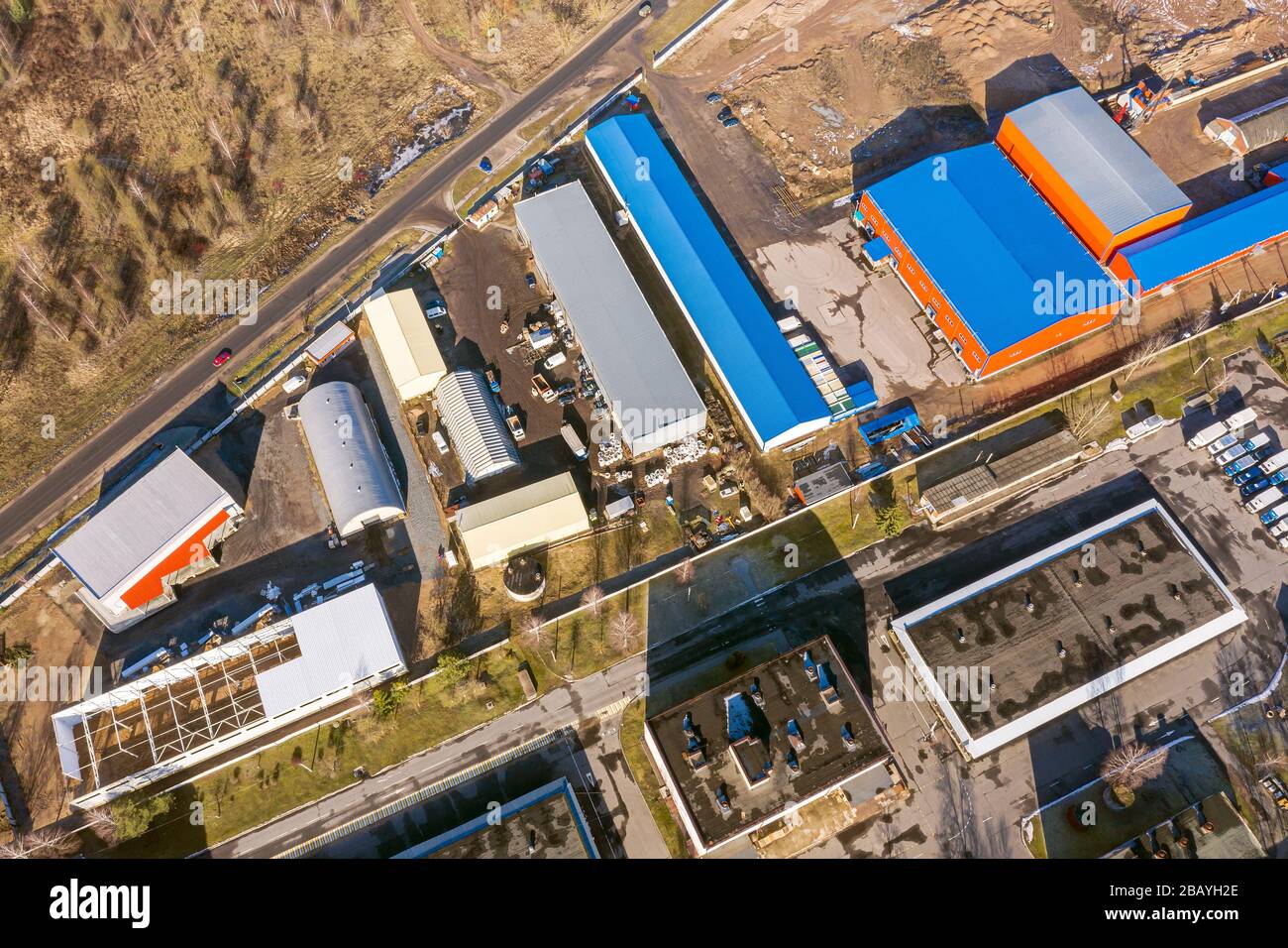 aerial view of suburb industrial area with group of modern warehouses, factory buildings and distributions centers. industrial district background Stock Photo