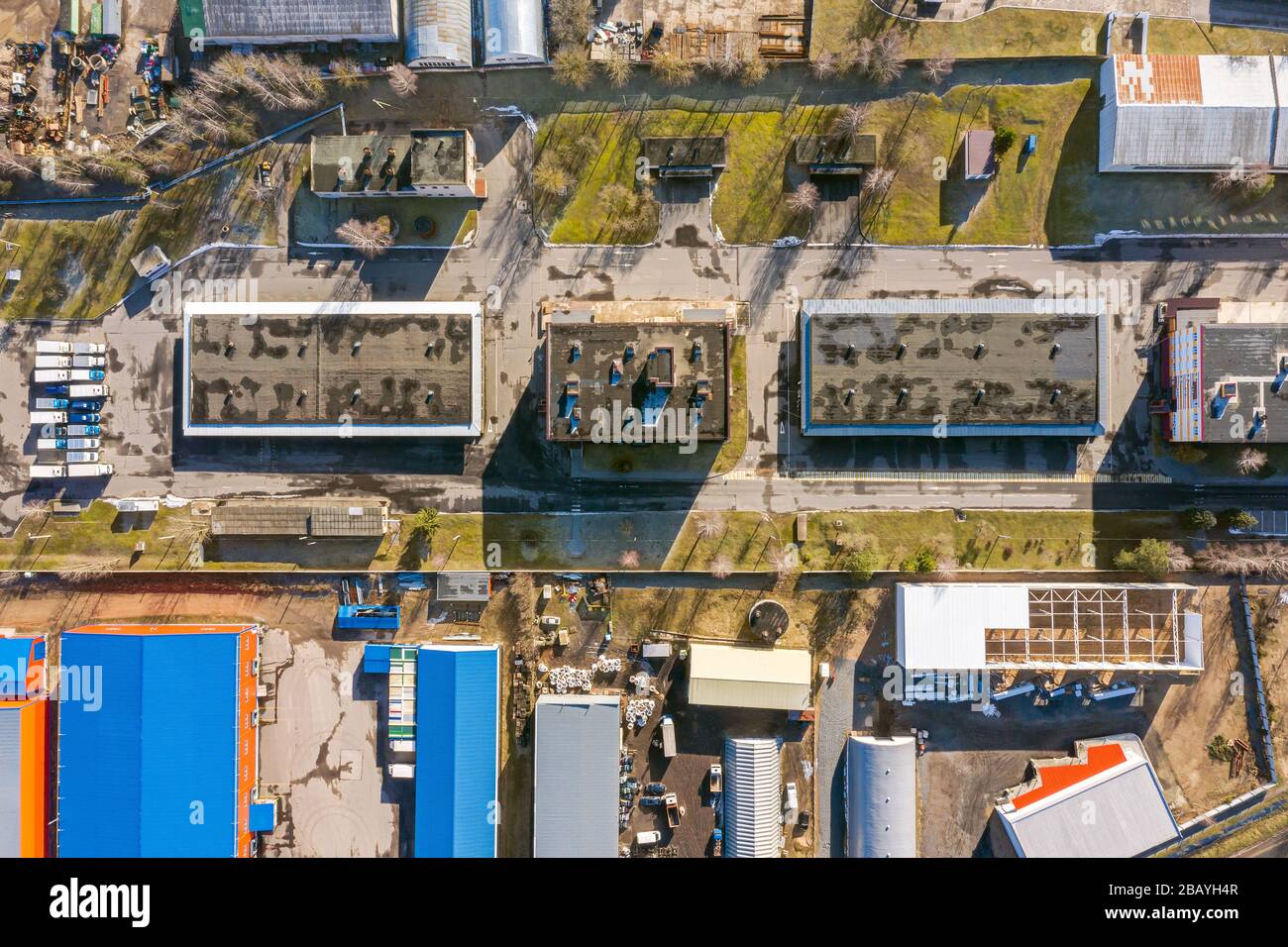 aerial view of suburb industrial area with group of modern warehouses, factory buildings and distributions centers. industrial district background Stock Photo