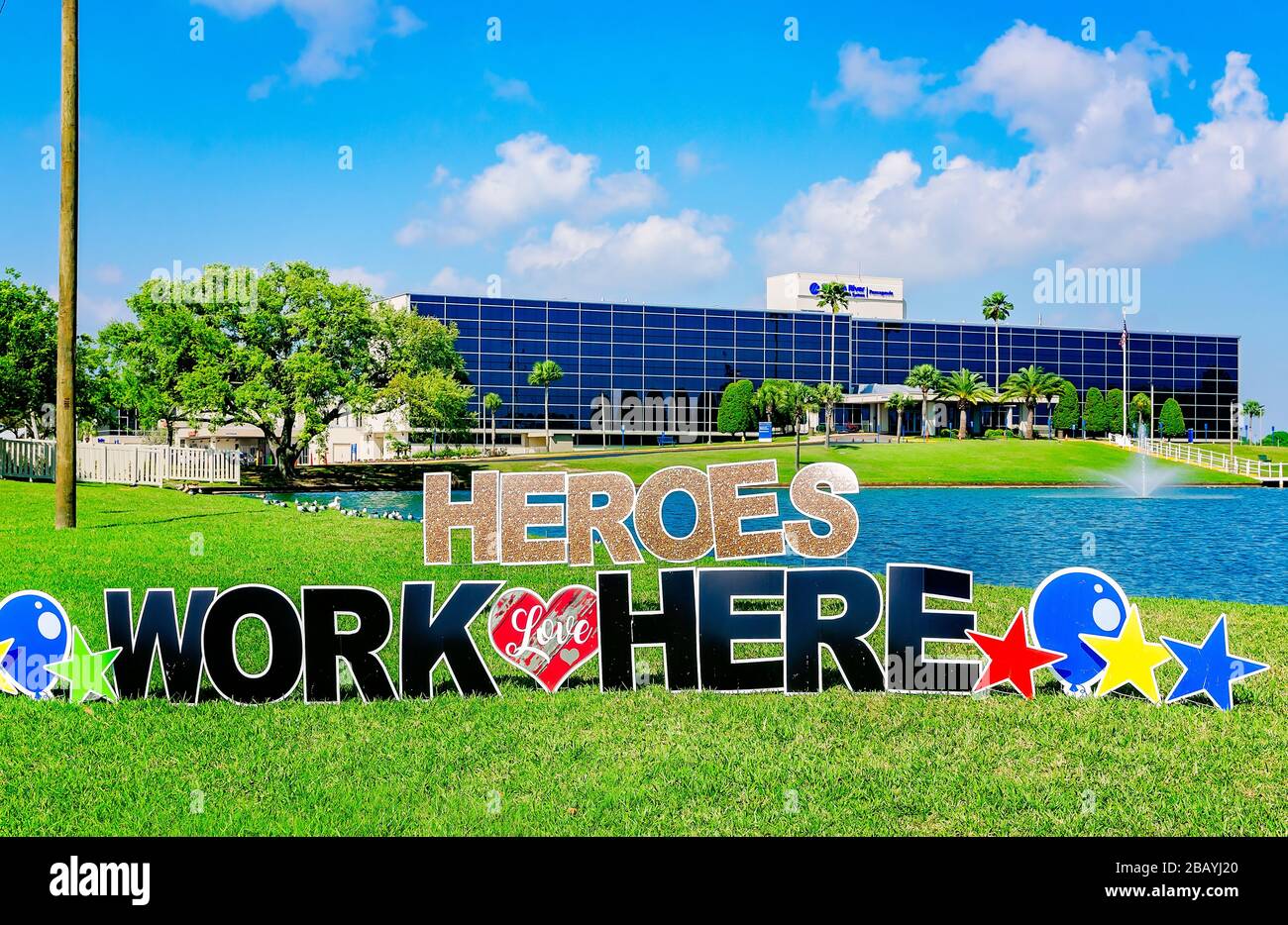 A sign saying “Heroes Work Here” stands in front of Singing River Hospital, March 26, 2020, in Pascagoula, Mississippi. Stock Photo