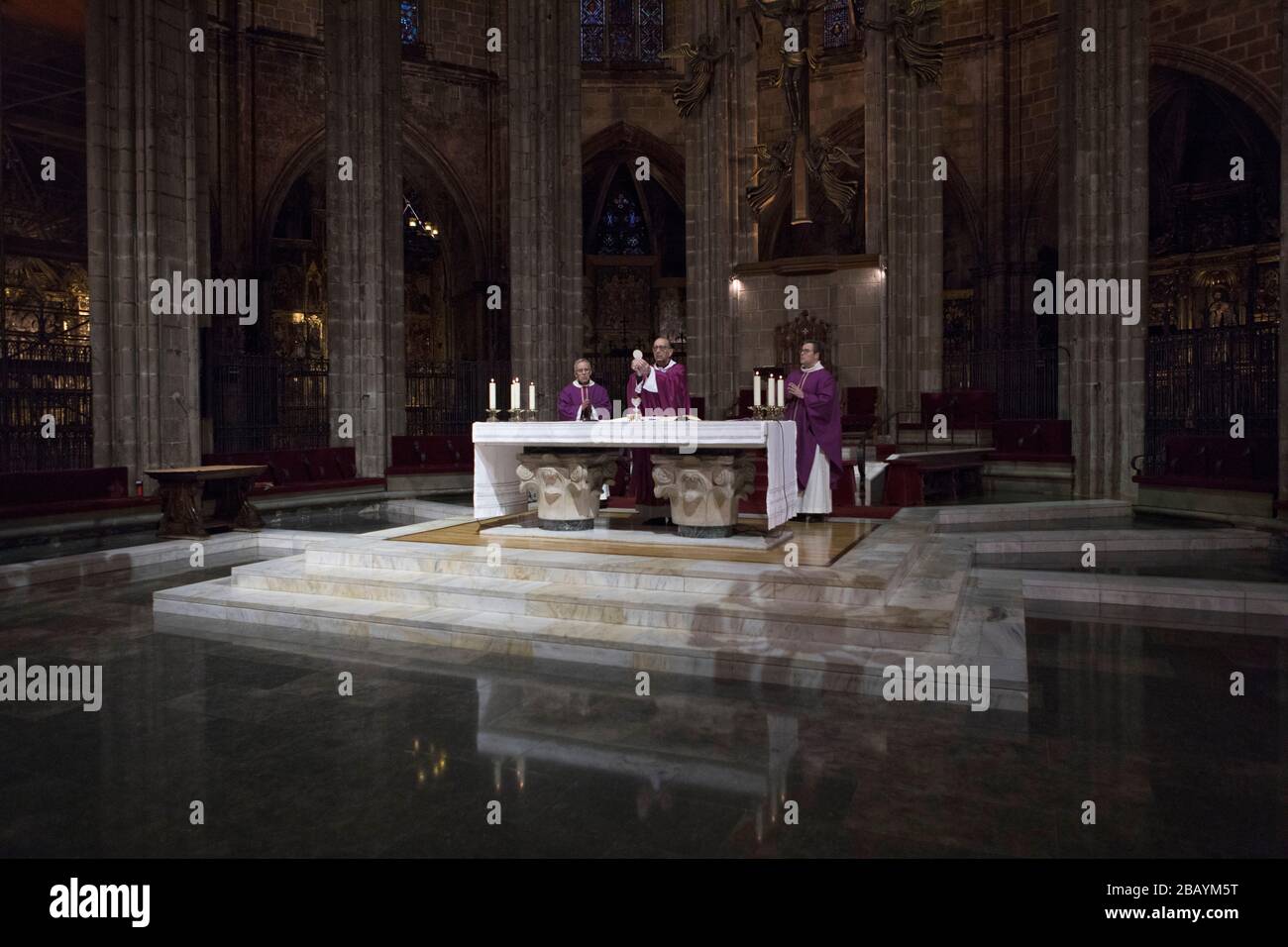 Mass at the Cathedral of Barcelona behind closed doors. Stock Photo