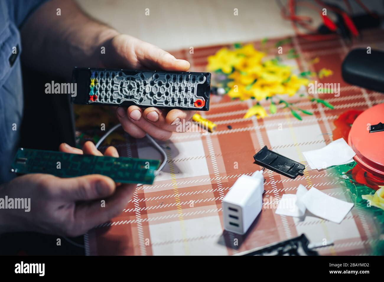 man hands repair make broken tv remote Stock Photo Alamy