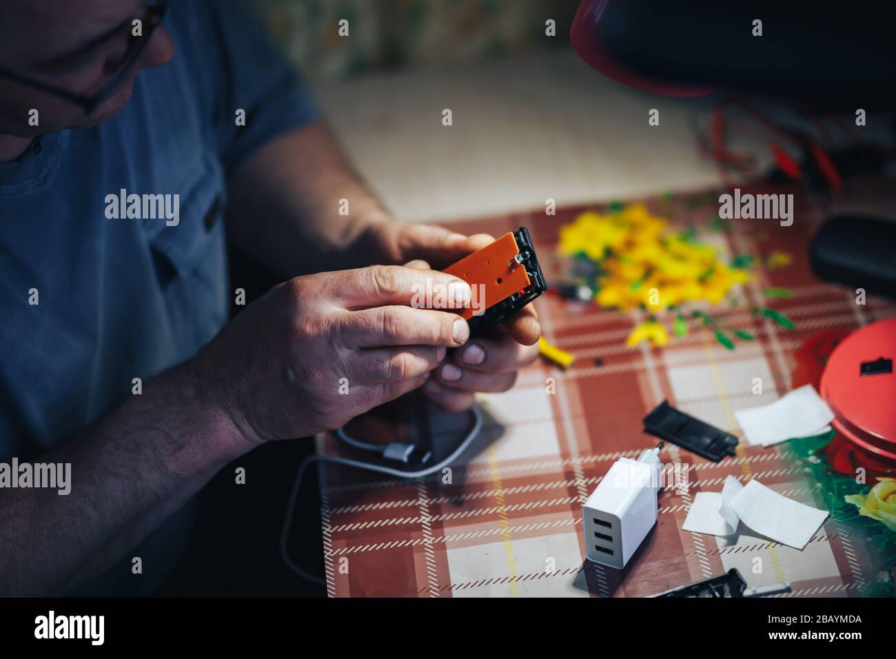 man hands repair make broken tv remote Stock Photo Alamy