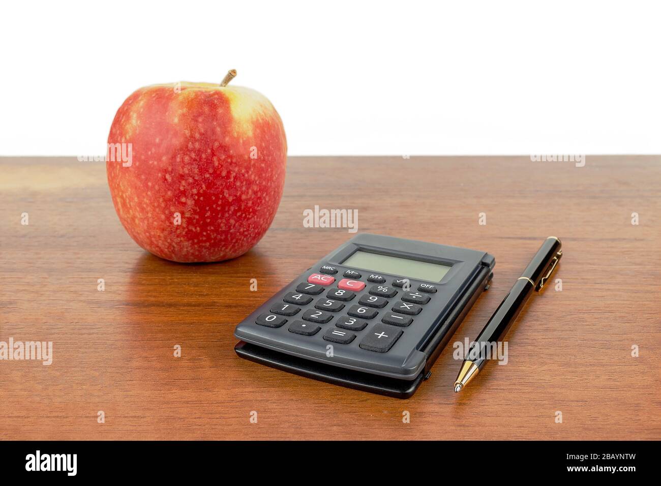 Apple calculator handle lie on the table. Stock Photo