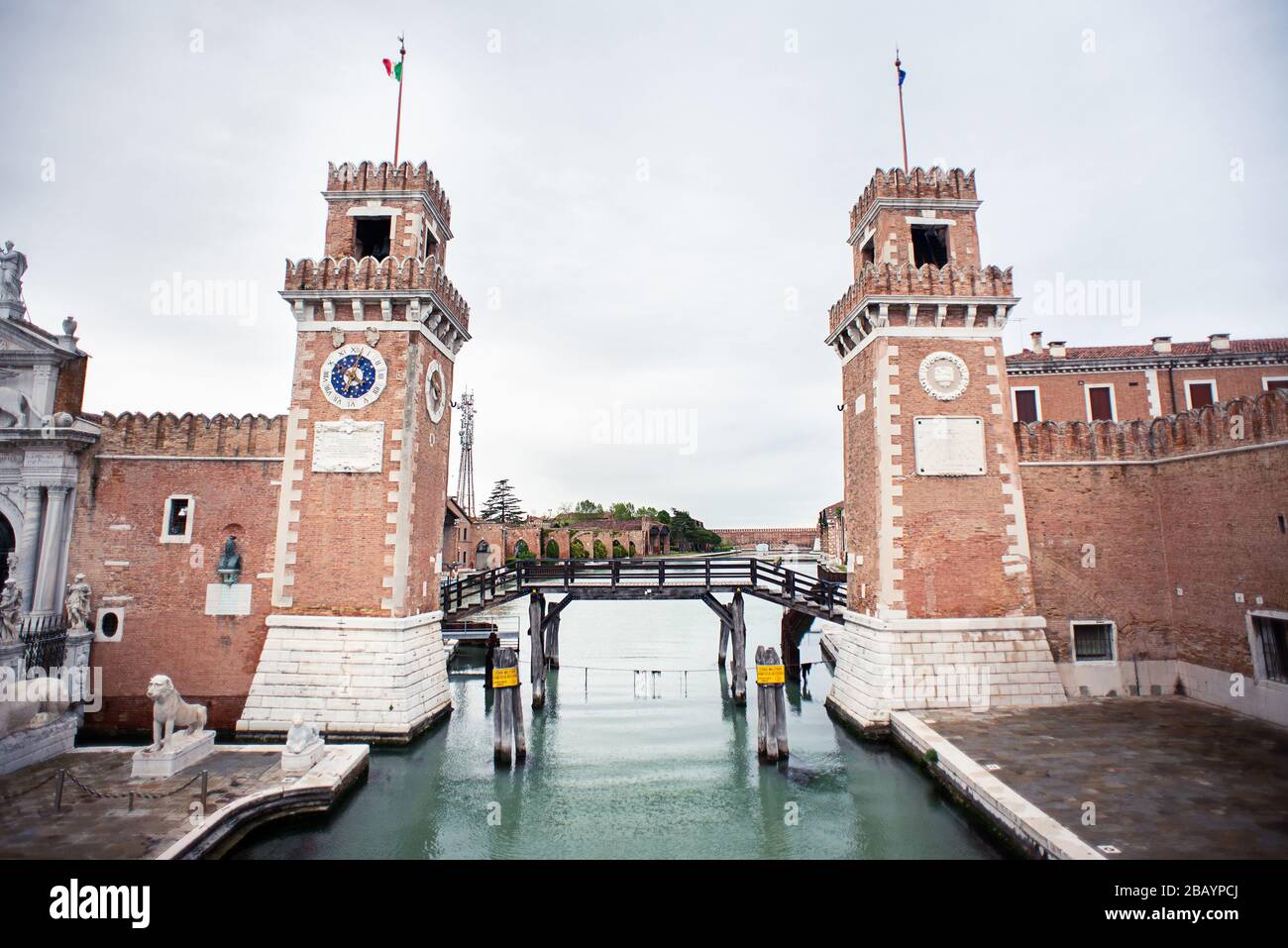 Venice. Italy - May 13, 2019: The Main Gate at the Venetian Arsenal (Arsenale di Venezia). View from Ponte del Paradiso. Canal Rio dell Arsenale. Stock Photo
