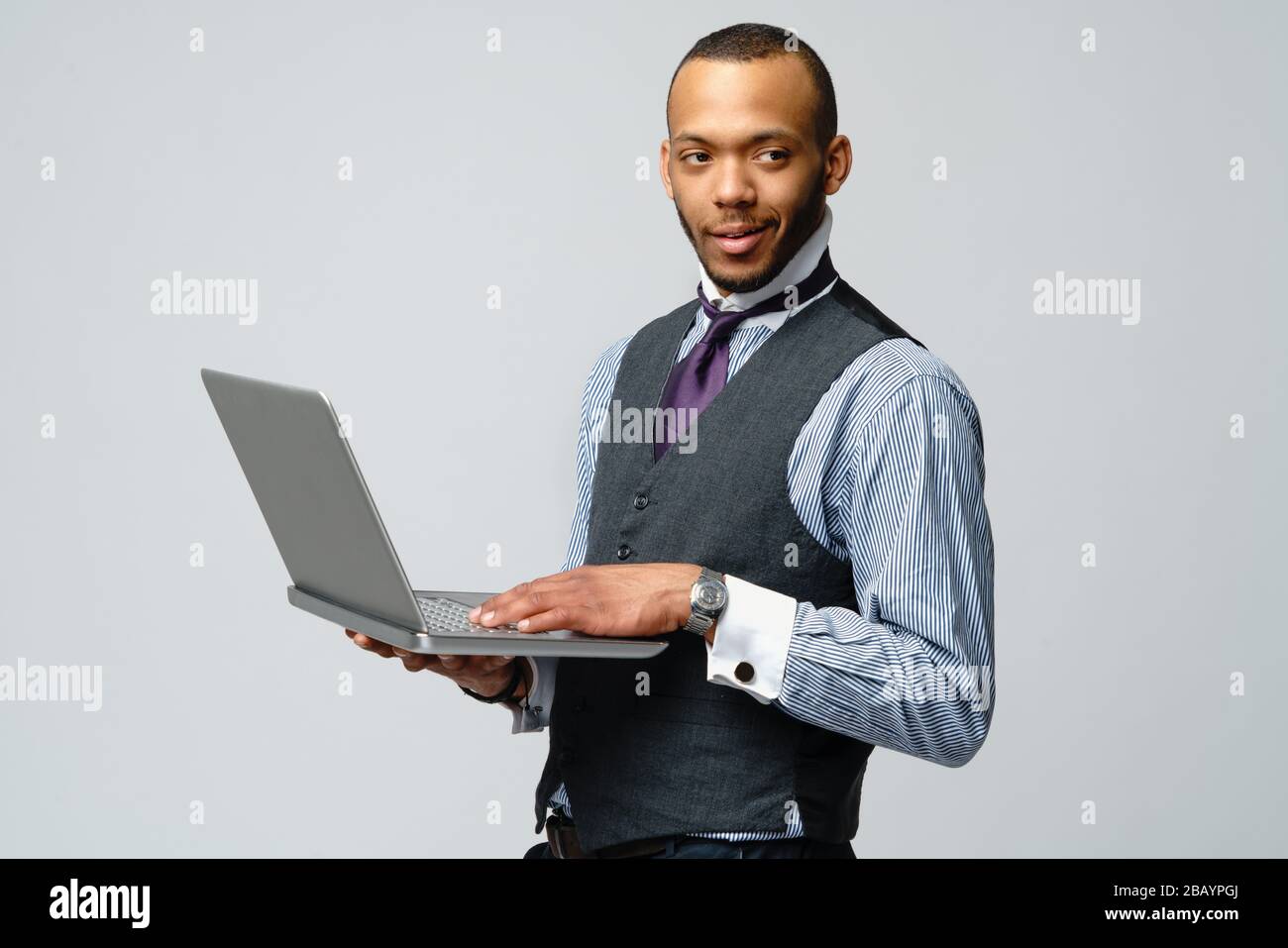professional african-american business man holding laptop computer Stock Photo