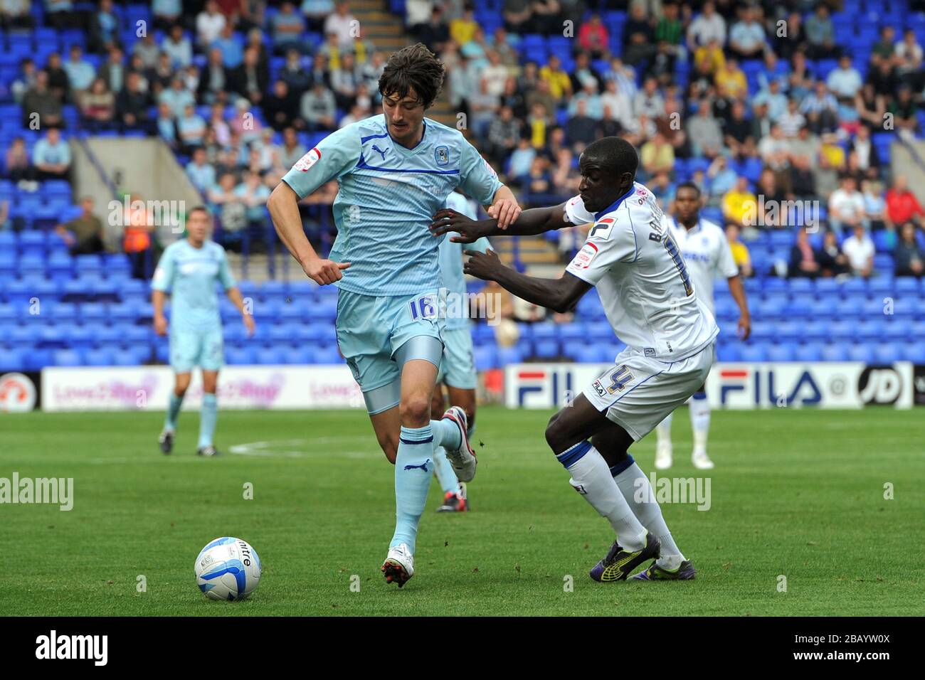 Coventry City's Adam Barton (left) and Tranmere Rovers' Zoumana Bakayogo battle for the ball. Stock Photo