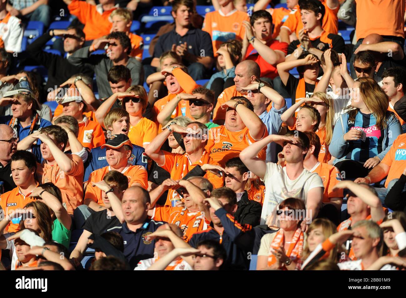 Blackpool fans shield their eyes from the sun in the stands Stock Photo -  Alamy