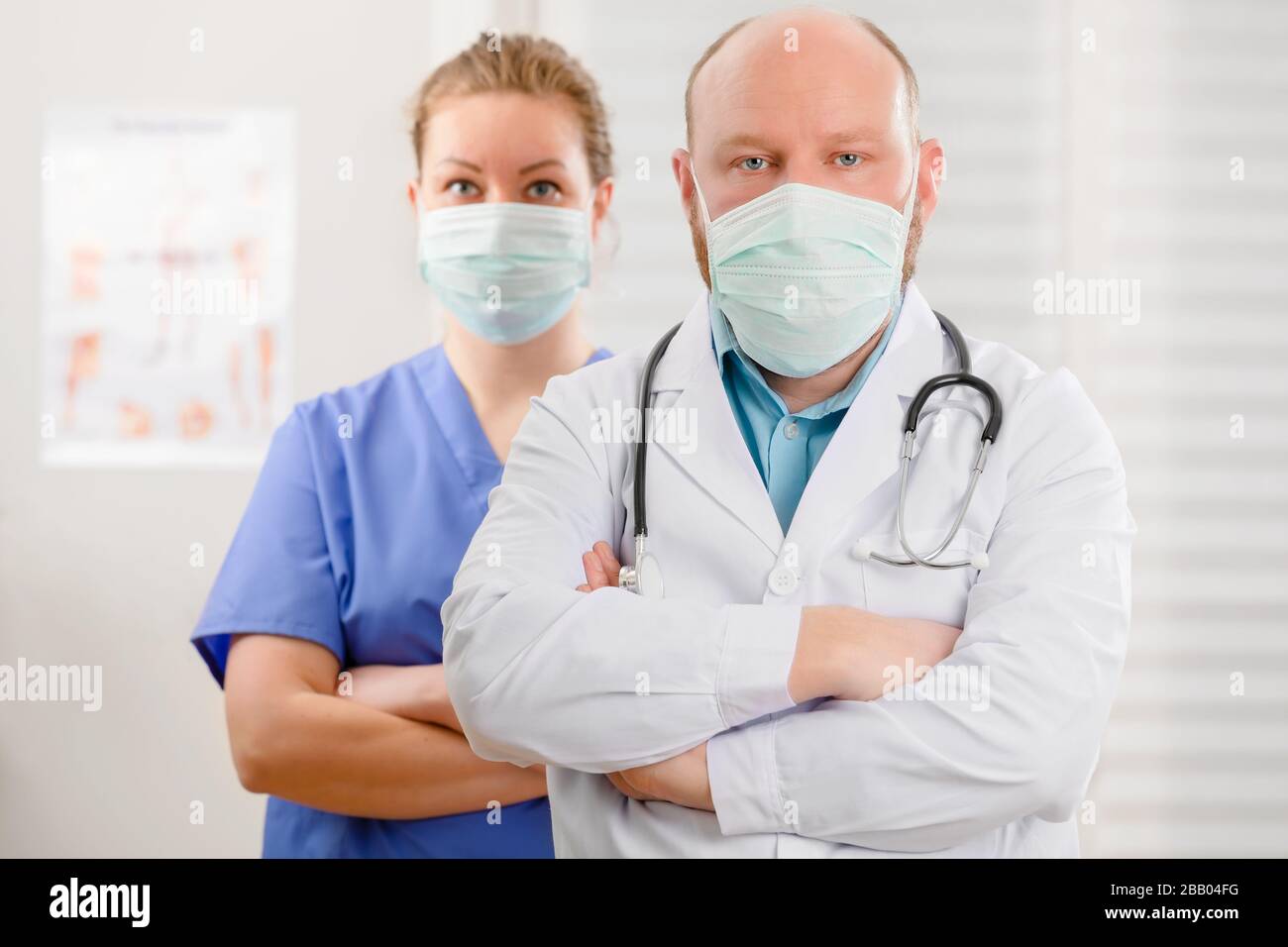 Confident and Exhausted Doctor And Nurse With Arms Crossed In Hostpital Stock Photo
