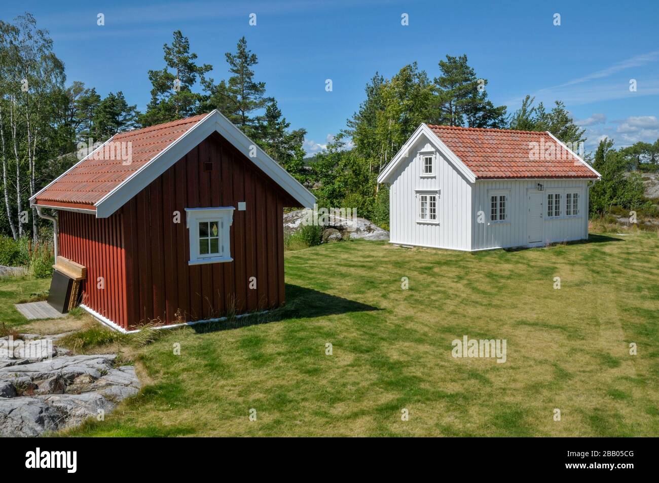 Newly built holiday home's annexe and outbuilding in the traditional architectural style of wooden houses on the south coast, Norway. Stock Photo