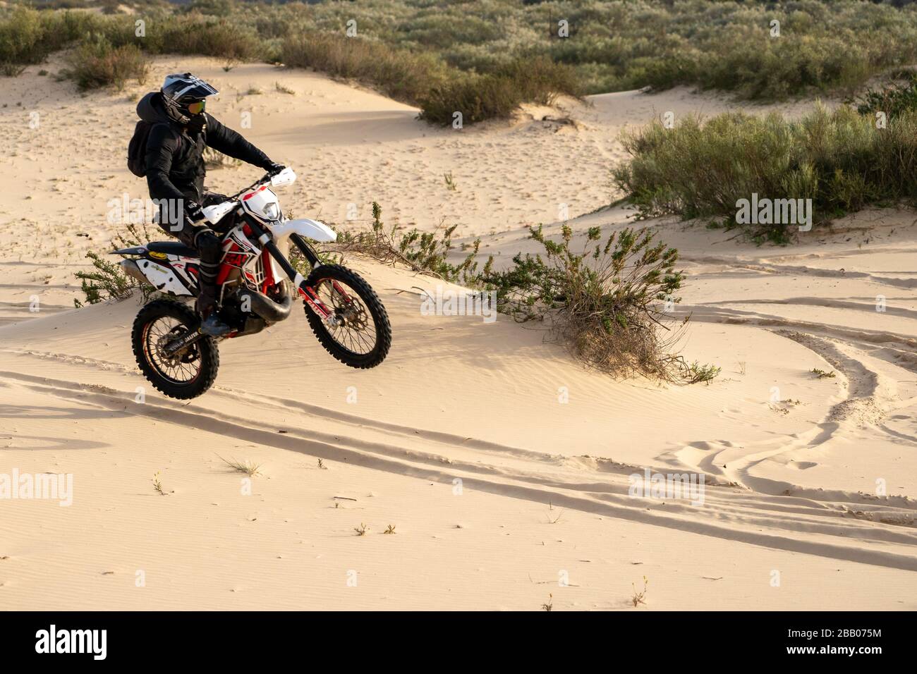 Dirt bike on a sand dune Stock Photo Alamy