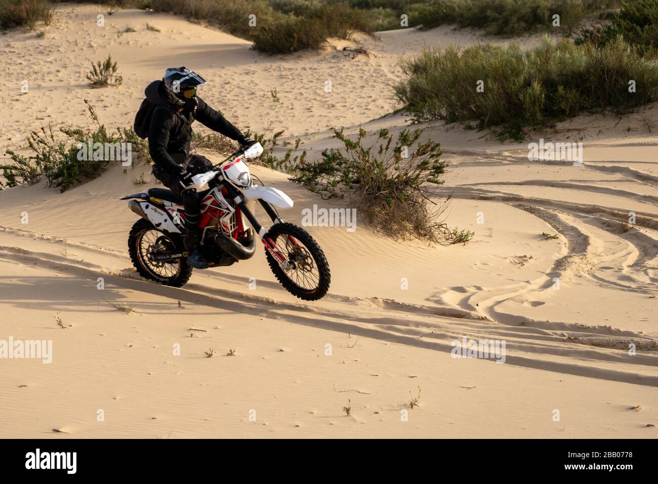 Dirt bike on a sand dune Stock Photo - Alamy