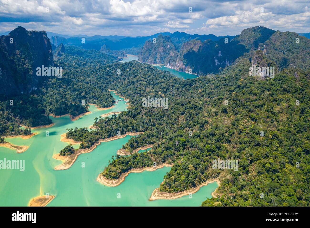 Aerial drone view of tropical rainforest and small islands on a huge lake surrounded by limestone cliffs (Cheow Lan, Khao Sok, Thailand) Stock Photo
