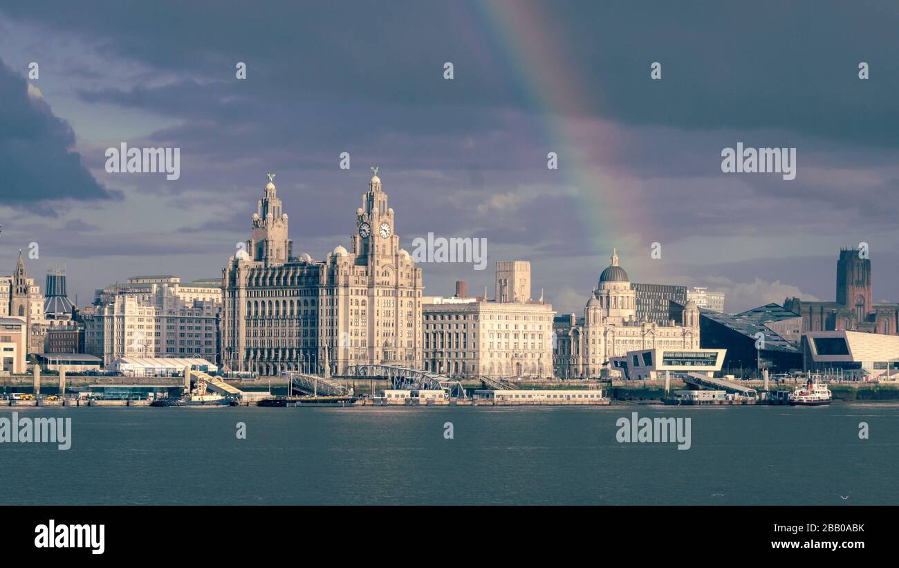 Rainbow over Liverpool waterfront, pier head, liver buildings, cunard buildings Anglican cathedral on the River Mersey,Liverpool England UK Stock Photo