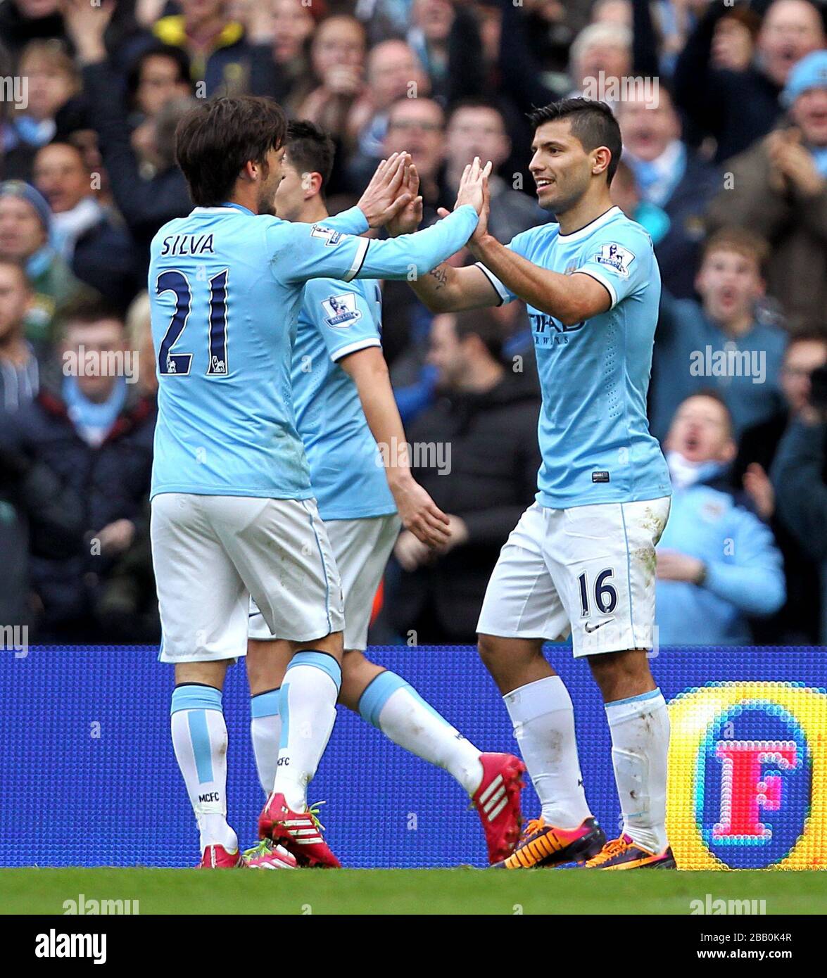 Manchester City's Sergio Aguero (right) celebrates with team-mate David Silva after scoring his side's first goal of the game Stock Photo