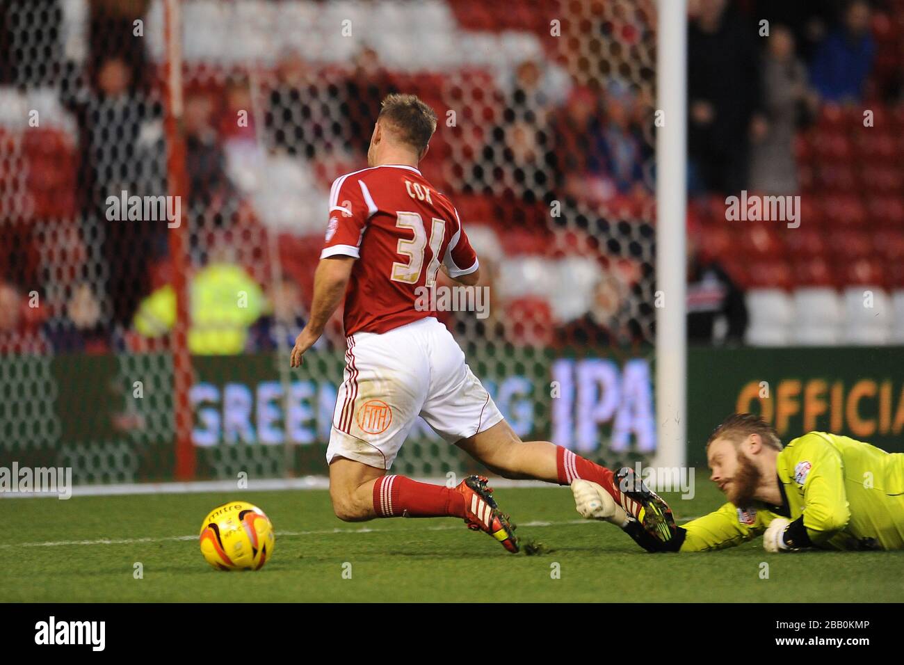 Nottingham Forest's Simon Cox is brough down in the penalty area by Ipswich Town goalkeeper Dean Gerken Stock Photo