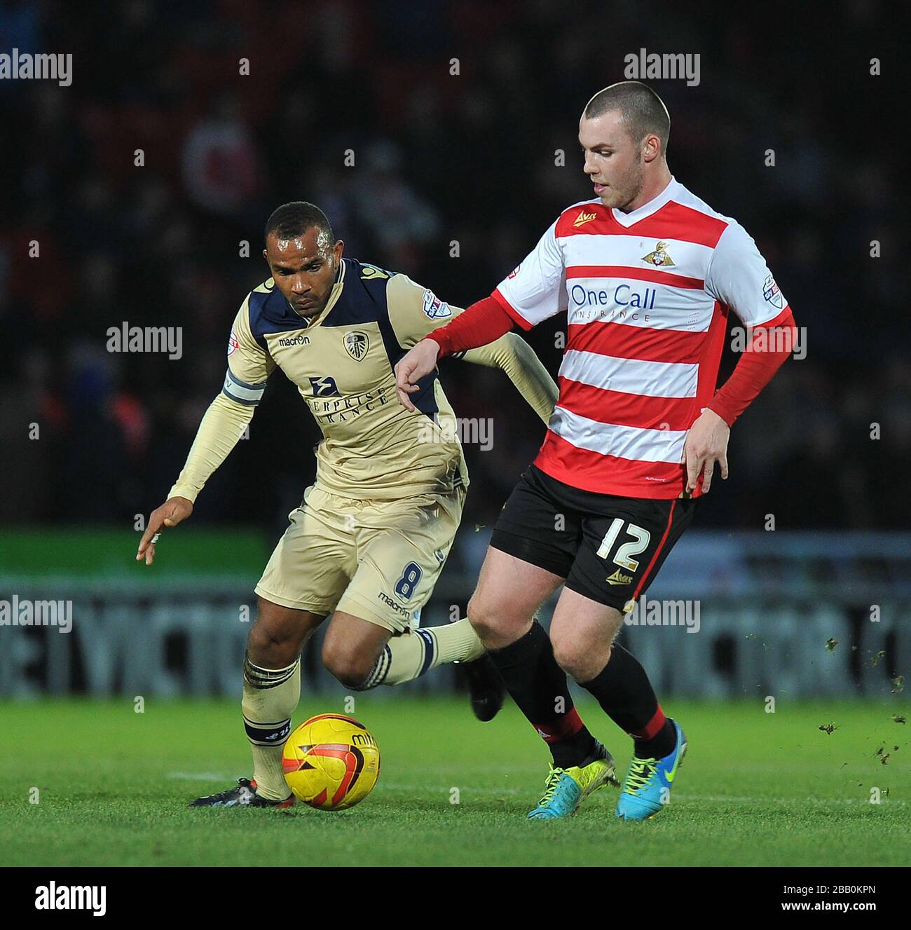 Doncaster rovers luke mccullough holds off leeds uniteds rodolph austin
