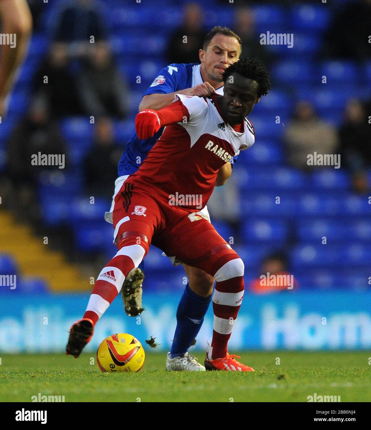 Birmingham City's Dariusz Dudka (back) and Middlesbrough's Kei Kamara (front) battle for the ball. Stock Photo