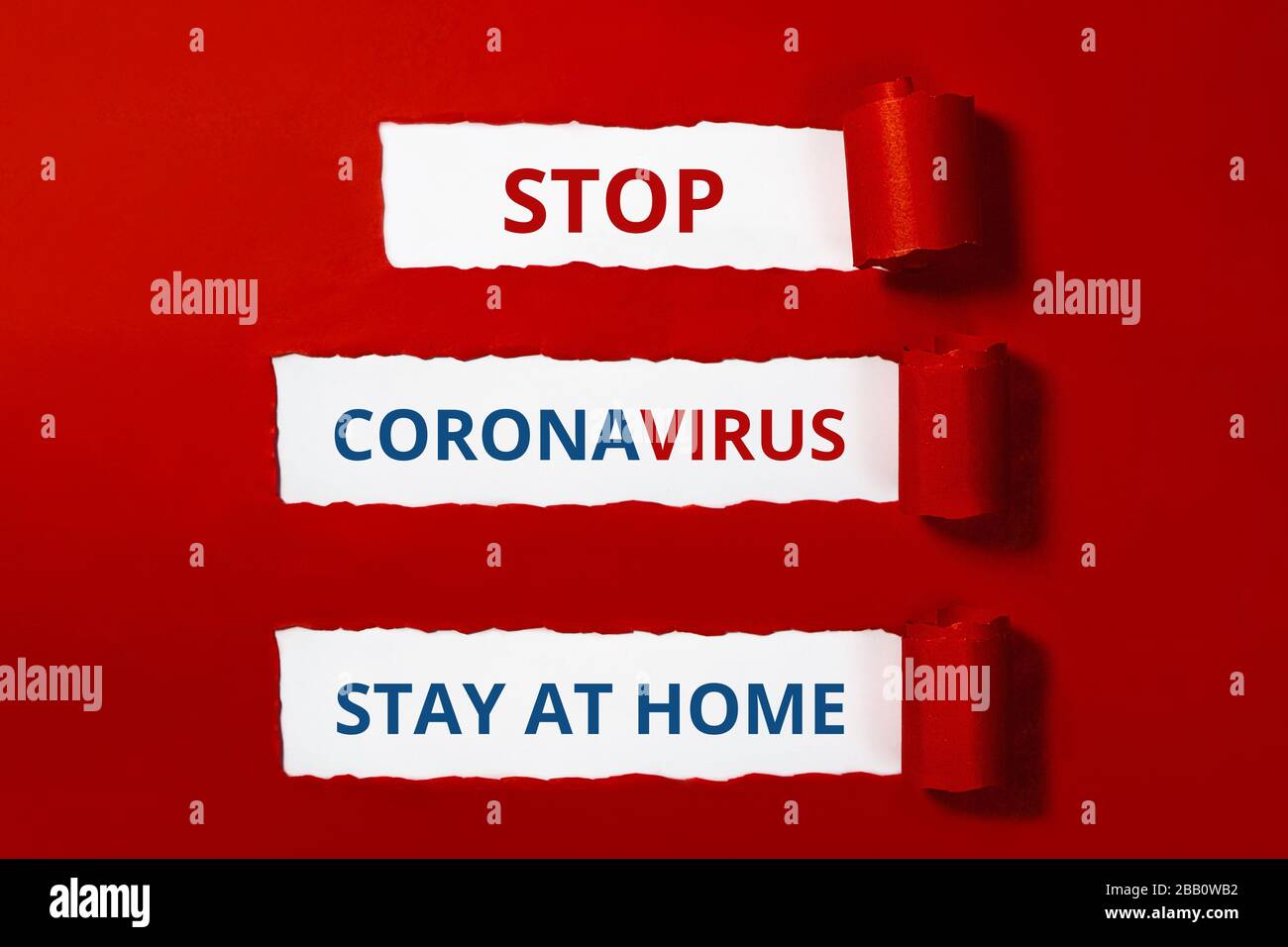 Words on red craft paper. Stop coronavirus layout. Stay at home. Outbreak of coronavirus concept. Novel virus - COVID-19-nCoV. Stock Photo