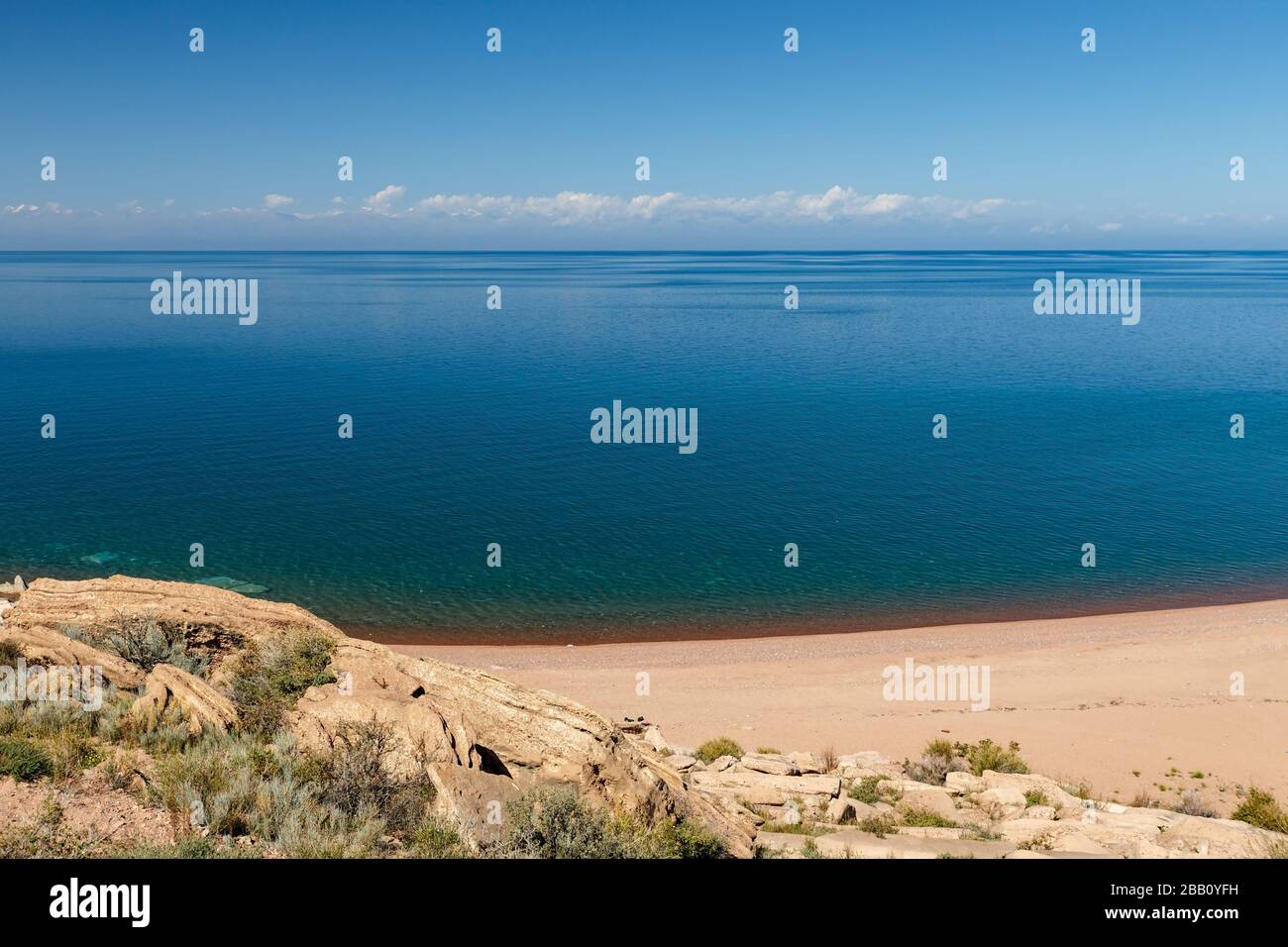 Issyk-Kul Lake, empty sandy beach on the southern shore of the lake, Kyrgyzstan Stock Photo