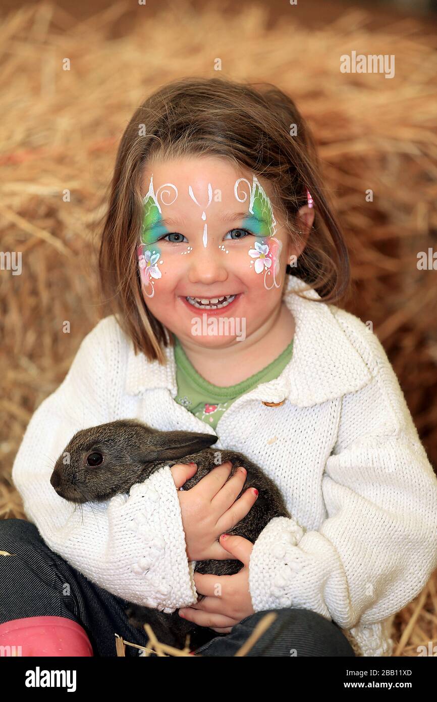 Children meet animals at the Cotswold Farm Park at the tented village