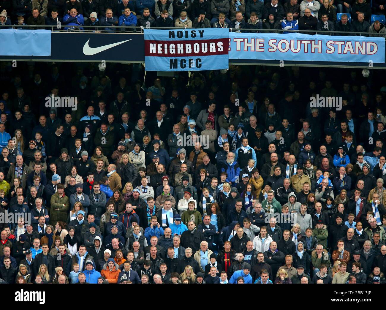 Manchester City fans in the stands in the stands with a 'Noisy