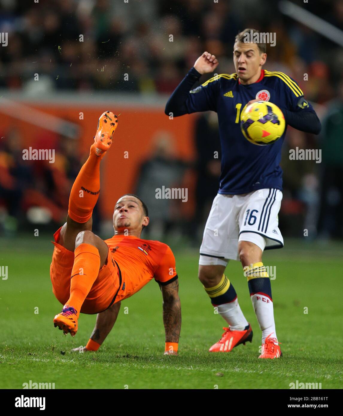 Netherlands'  Memphis Depay (left) and Colombia's  Santiago Arias battle for the ball Stock Photo