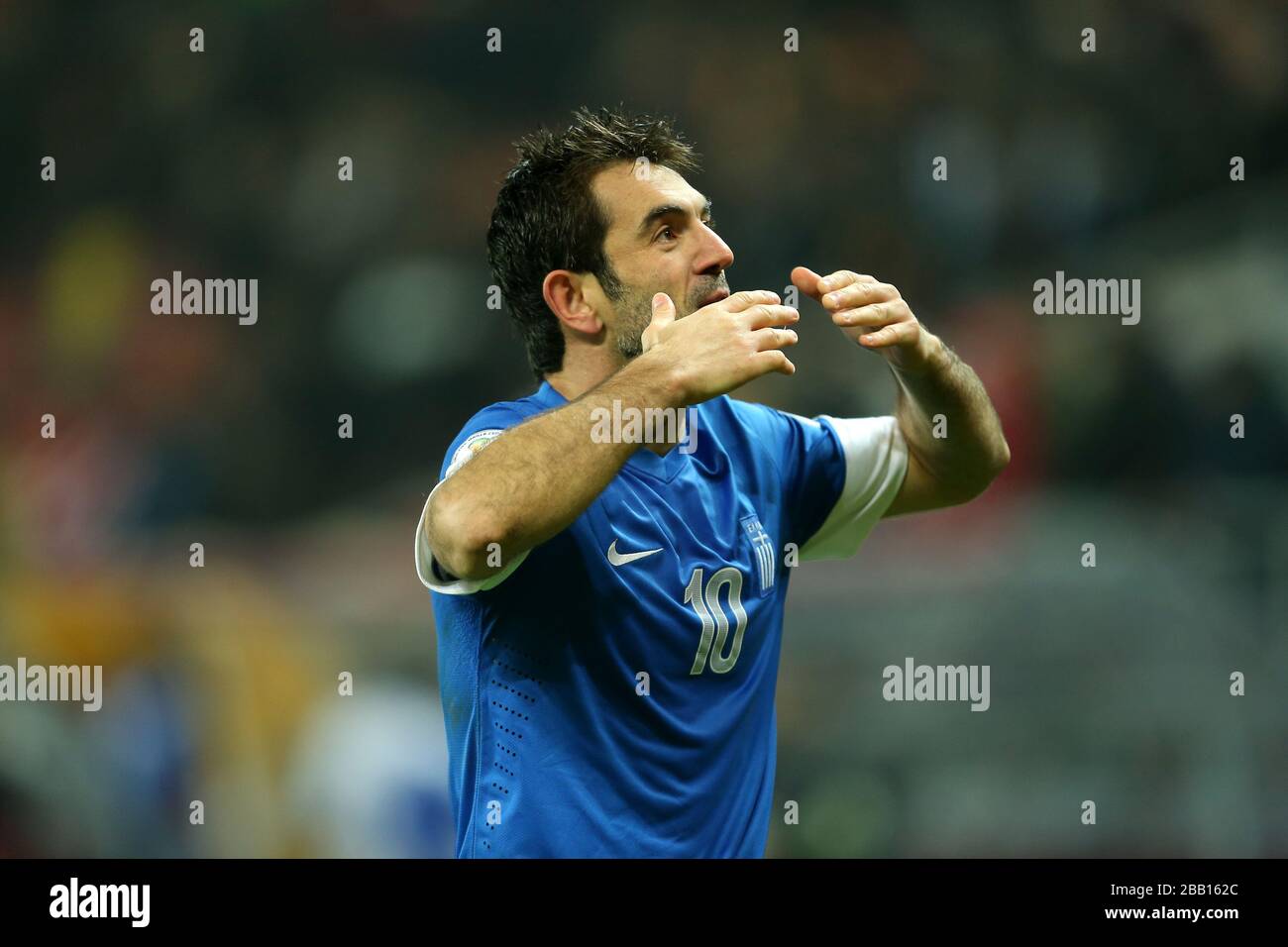 Greece's Georgios Karagounis celebrates victory and qualification for the World Cup Finals at the end of the match Stock Photo