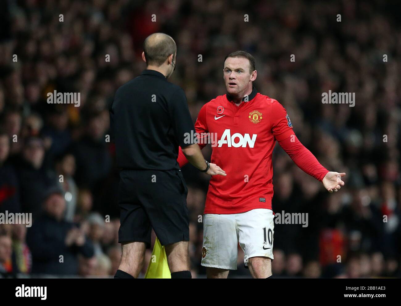 Manchester United's Wayne Rooney appeals to the referee's assistant ...