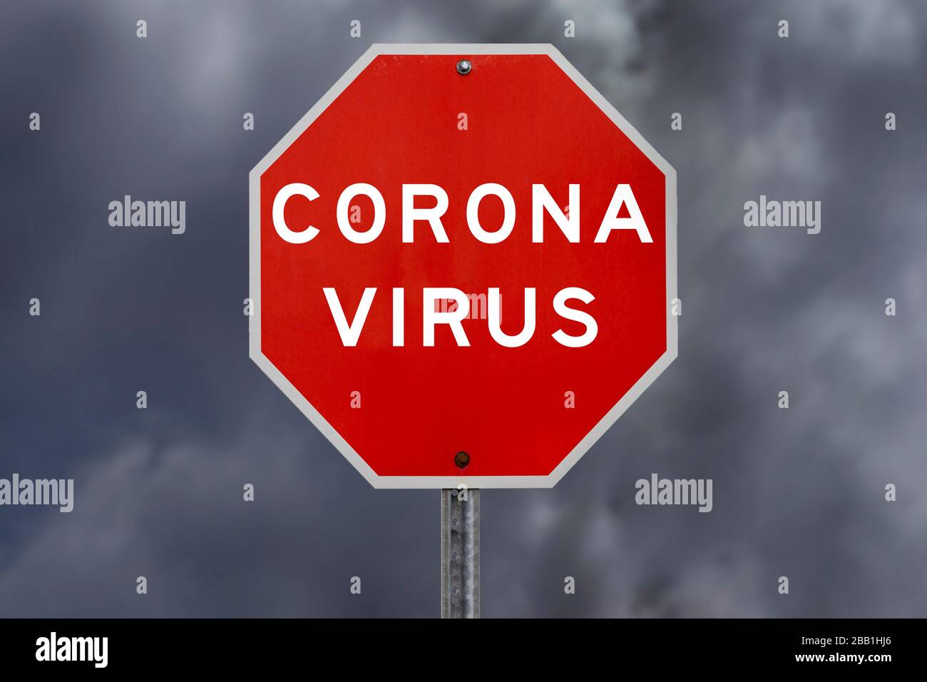 Corona virus warning sign with storm clouds in background Stock Photo