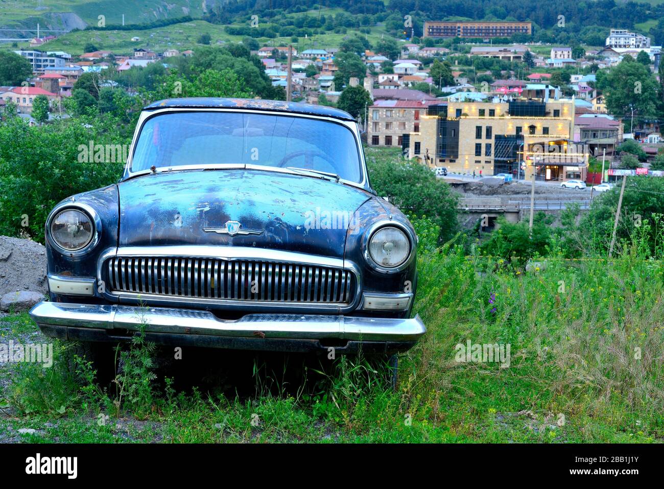 Old Car In A Hill Over Stepantsminda Kazbegi Area Georgia Stock Photo Alamy
