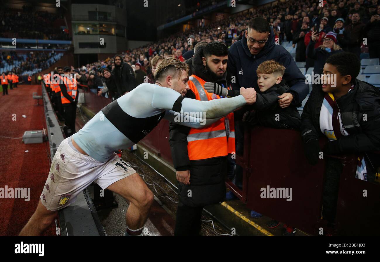 Aston Villa's Jack Grealish gives his captain's armband to a young fan  after the game Stock Photo - Alamy