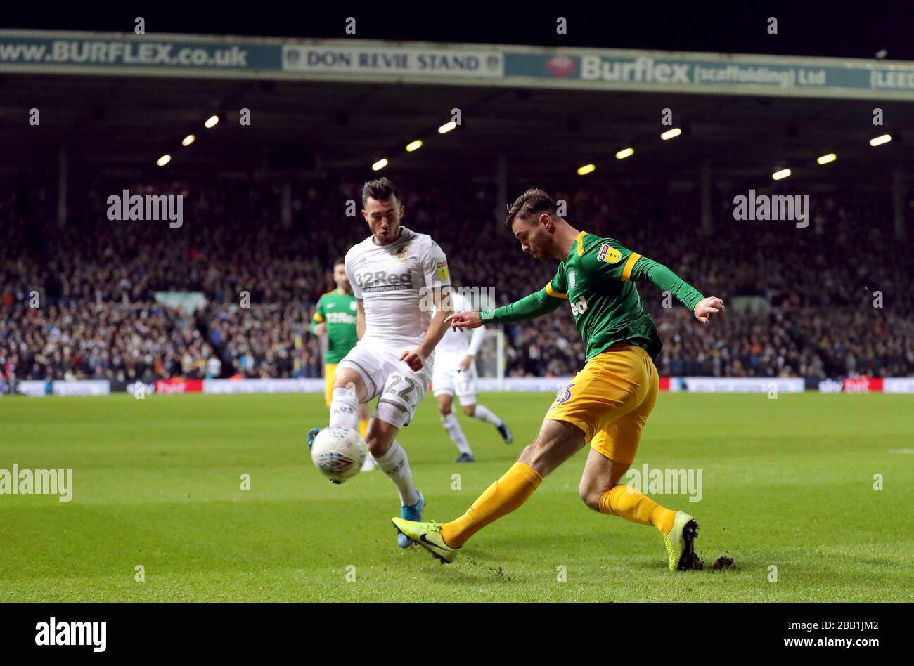Preston North End's Andrew Hughes crosses under pressure from Leeds United's Jack Harrison Stock Photo