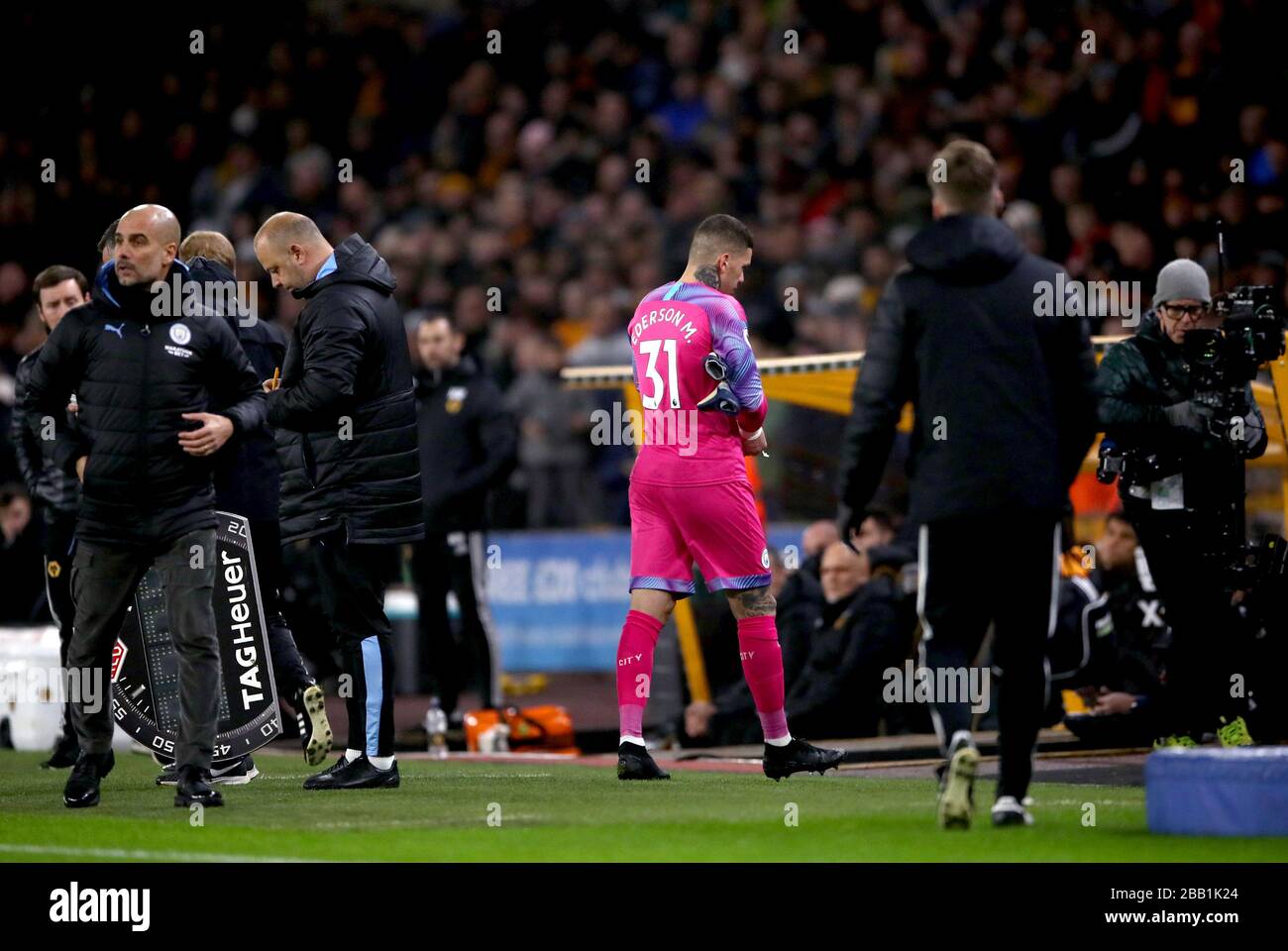 Manchester City goalkeeper Ederson leaves the pitch after receiving a red card from Referee Martin Atkinson Stock Photo