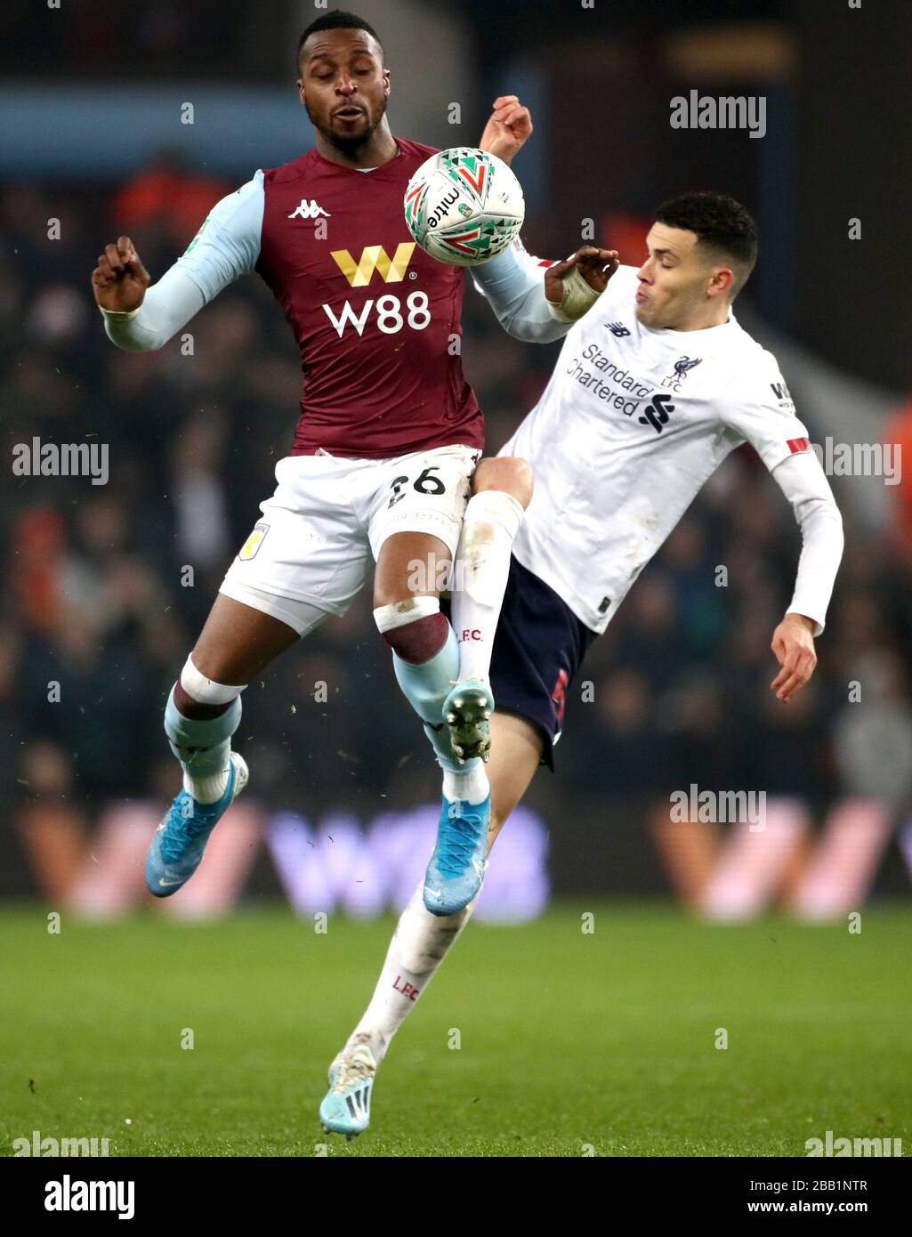 Aston Villa's Jonathan Kodjia (left) and Liverpool's Isaac Christie-Davies battle for the ball Stock Photo