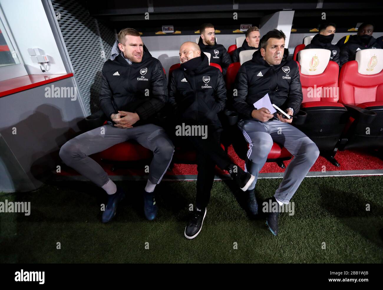 Arsenal interim manager Freddie Ljungberg (centre) with Arsenal interim assistant manager Per Mertesacker (left) on the bench Stock Photo