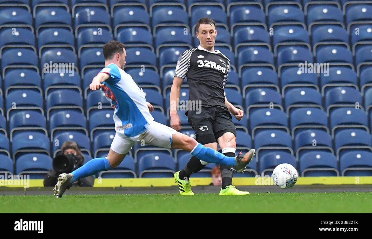 Derby County's Tom Lawrence battles with Blackburn Rovers' Lewis Travis Stock Photo