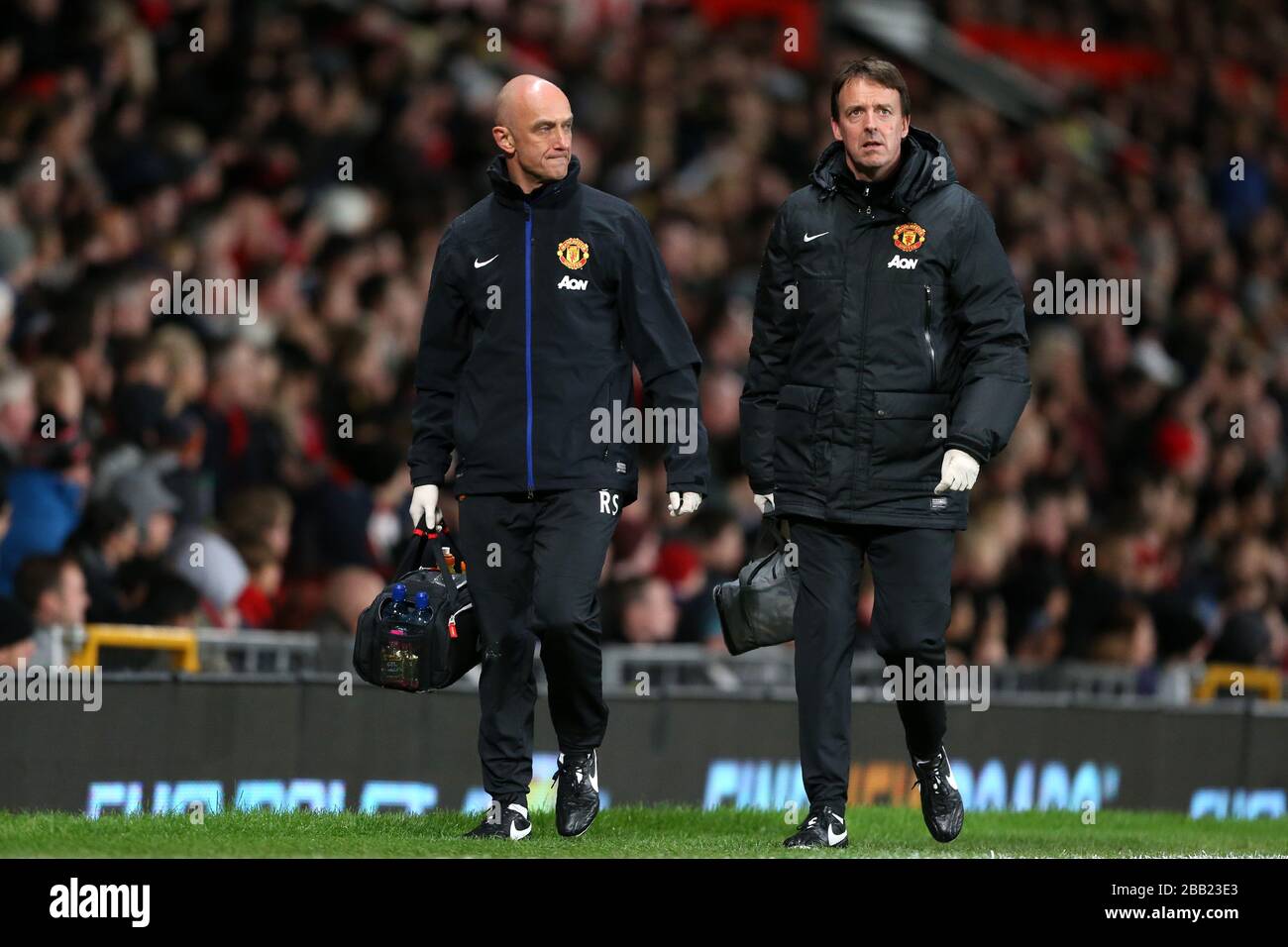 Manchester United's Head Physiotherapist Rob Swire (left)and club doctor Steve McNally  on the touchline Stock Photo
