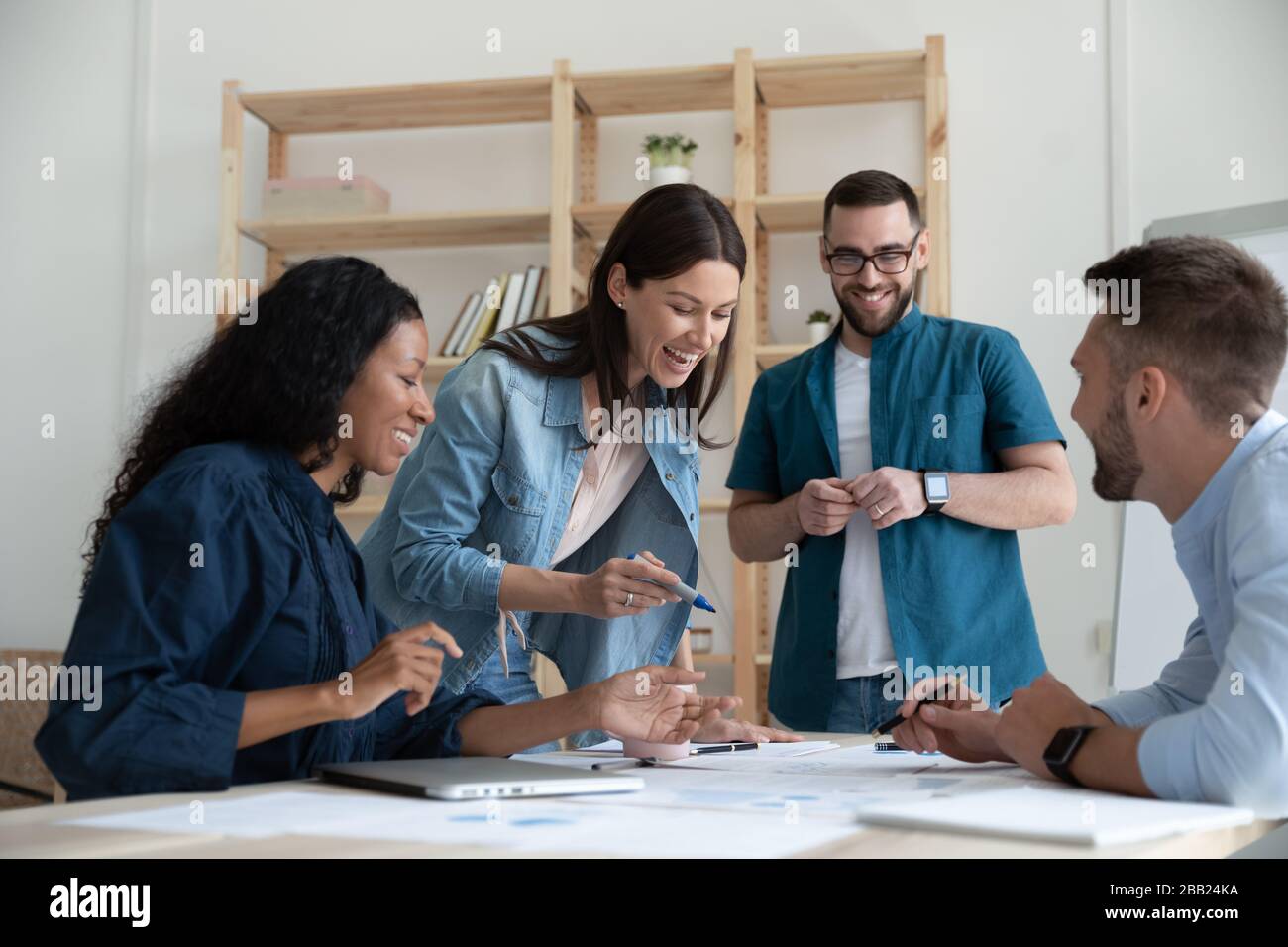 Happy multiracial coworkers have fun brainstorming at briefing Stock ...
