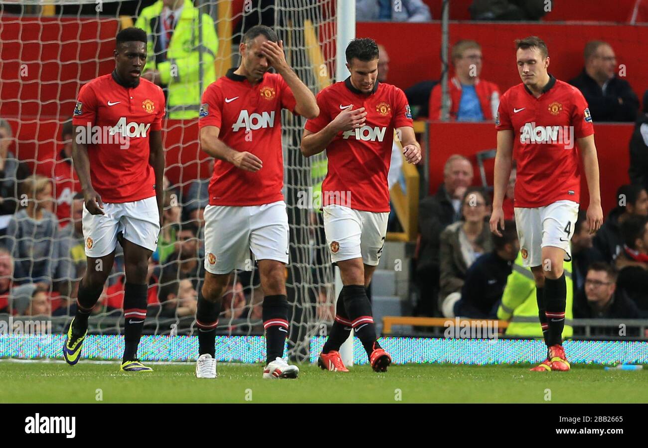 Manchester United's Danny Welbeck (left), Ryan Giggs (second left), Robin van Persie (second right) and Phil Jones appear dejected after Southampton's Adam Lallana (not in picture) scores his team's equalising goal Stock Photo