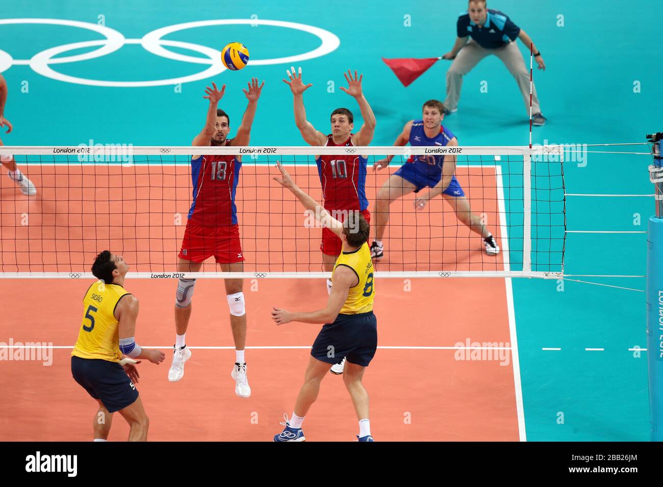 Russia's Alexander Volkov (left) blocks a shot  in  the Men's Volleyball Gold  Medal Match at London's Earl Court during the final day of the London 2012 Olympics Stock Photo