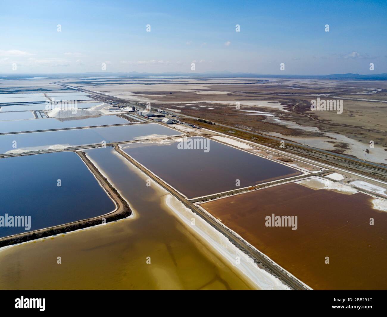 Salt harvesting using solar evaporation ponds at Port Alma Queensland Australia Stock Photo