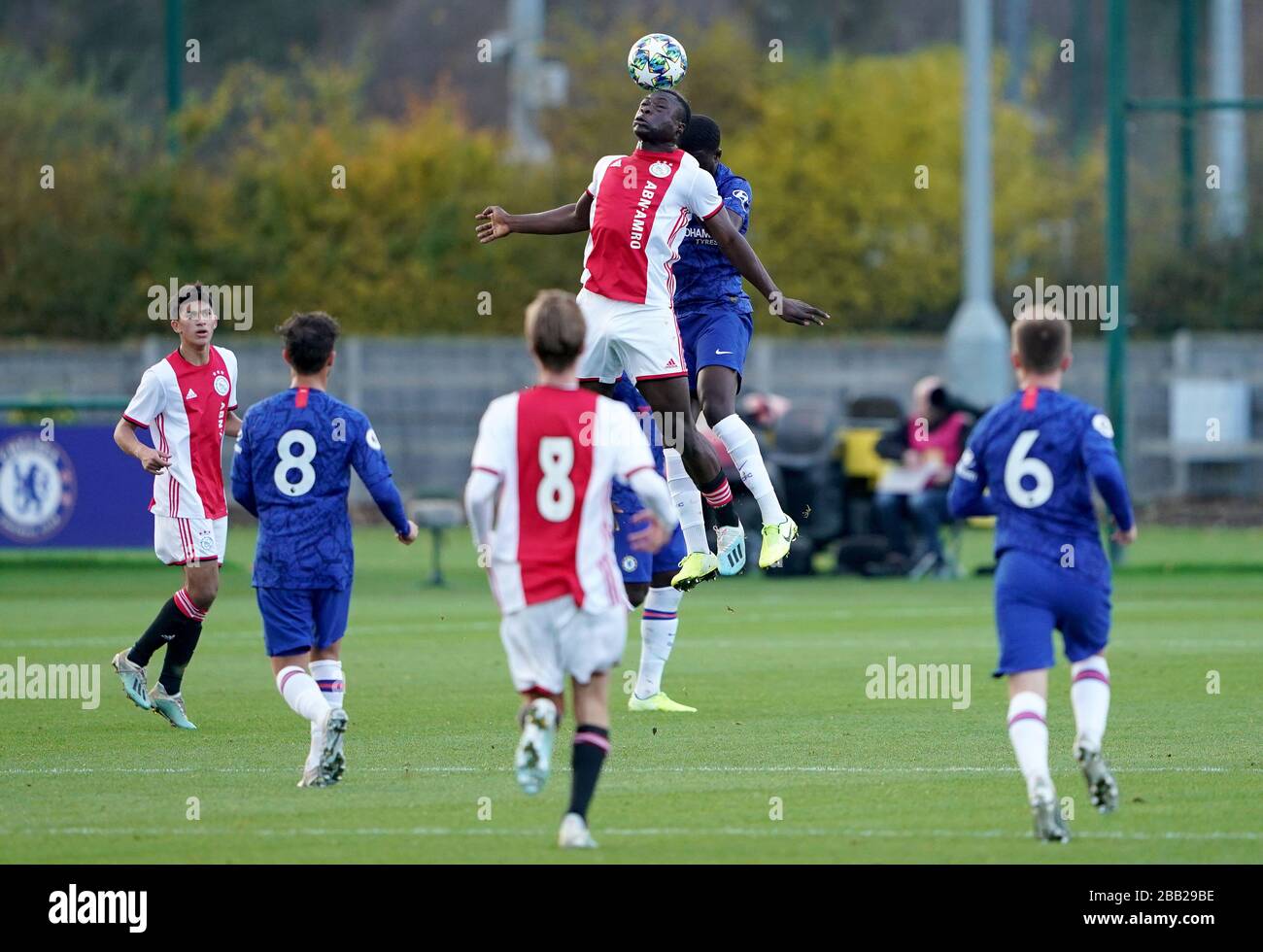 Ajax's Brian Brobbey (centre) jumps highes for the ball Stock Photo