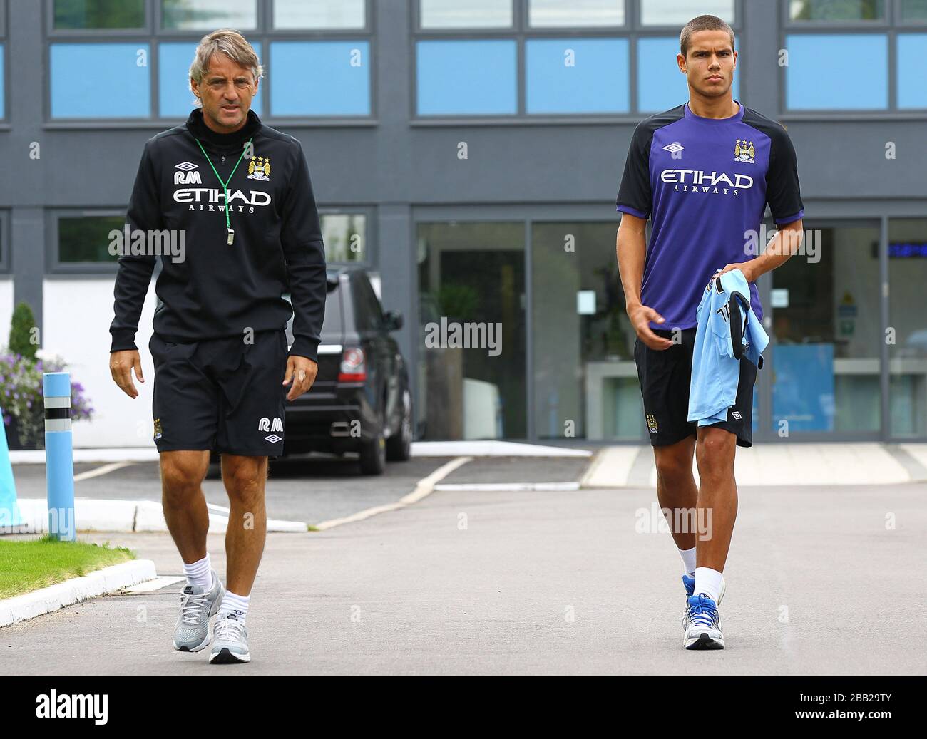 Manchester City manager Roberto Mancini (left) with Jack Rodwell at ...
