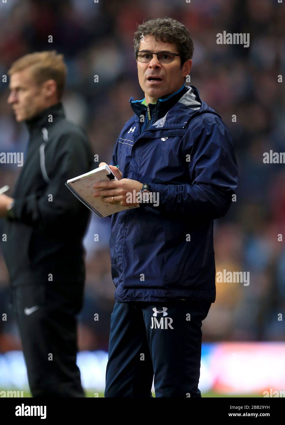 Tottenham Hotspur's first-team fitness coach Jose Mario Rocha on the touchline Stock Photo