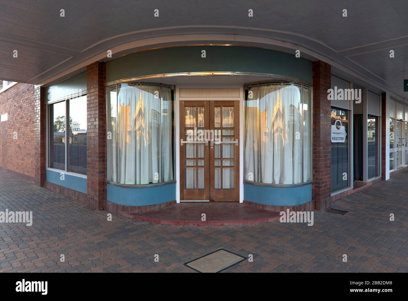 Curved glass corner entrance Charleville Queensland Australia Stock Photo